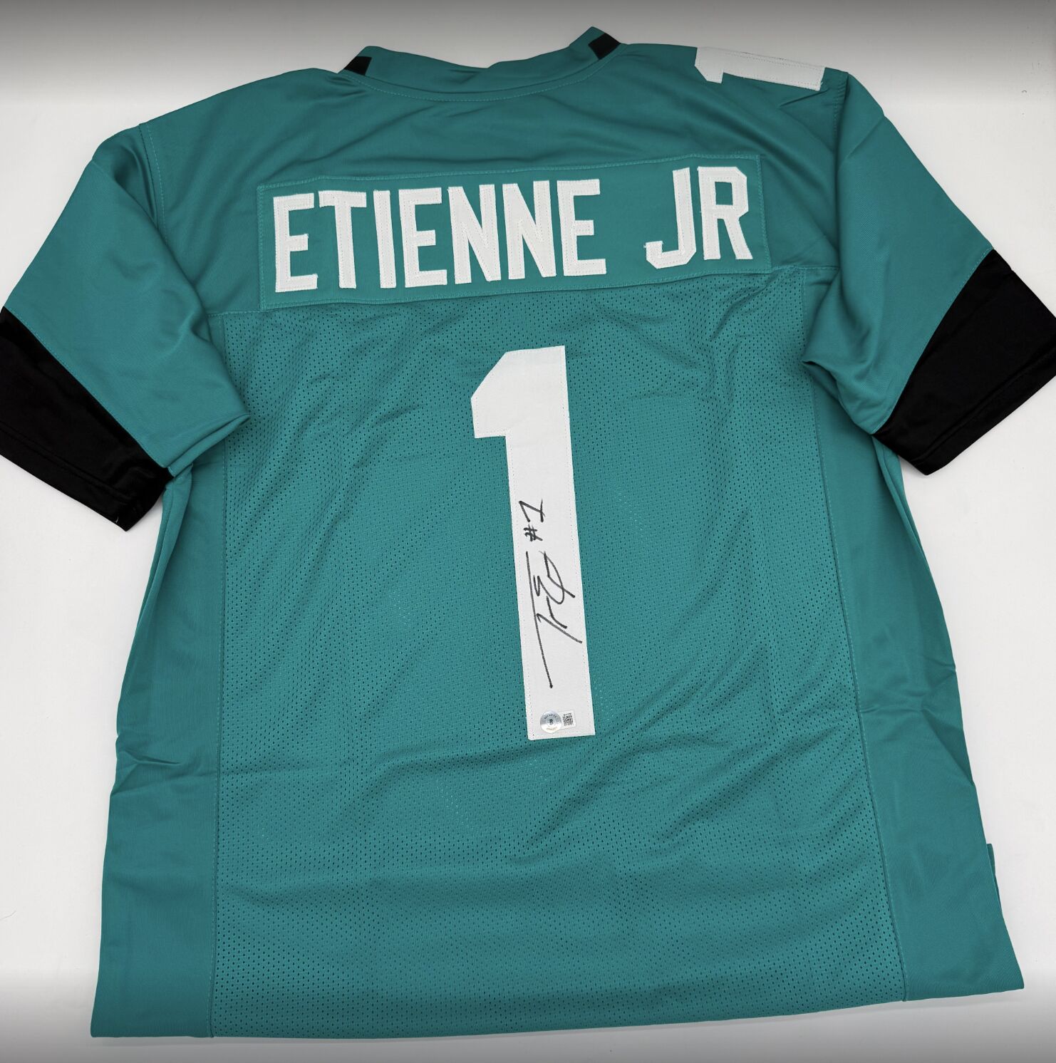 Etienne Signed Teal Custom Jersey