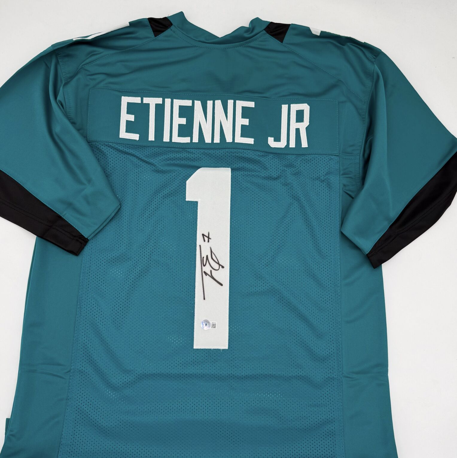 Etienne Signed Teal Custom Jersey